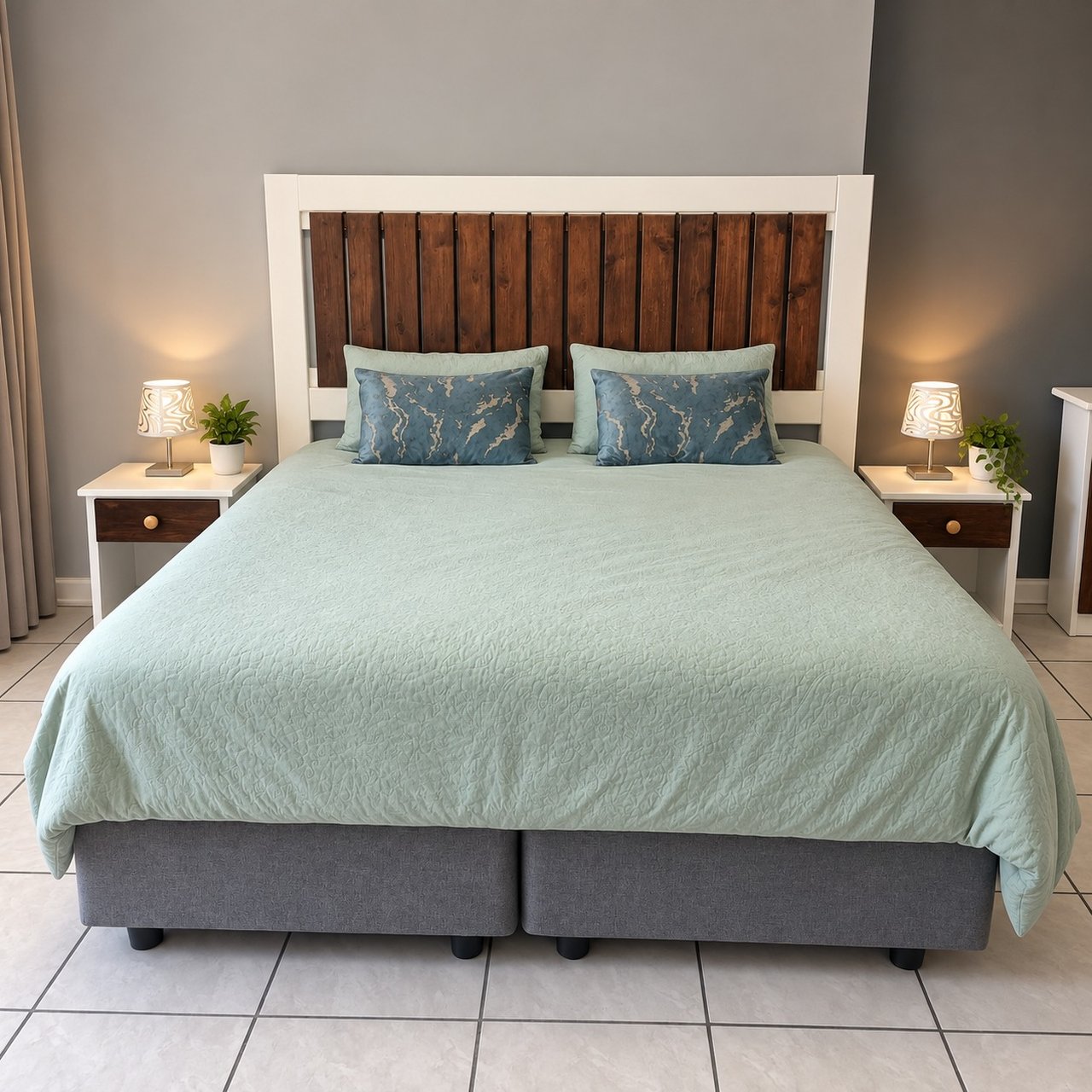 Master bedroom with king-size bed, wooden headboard and pale aqua bedding